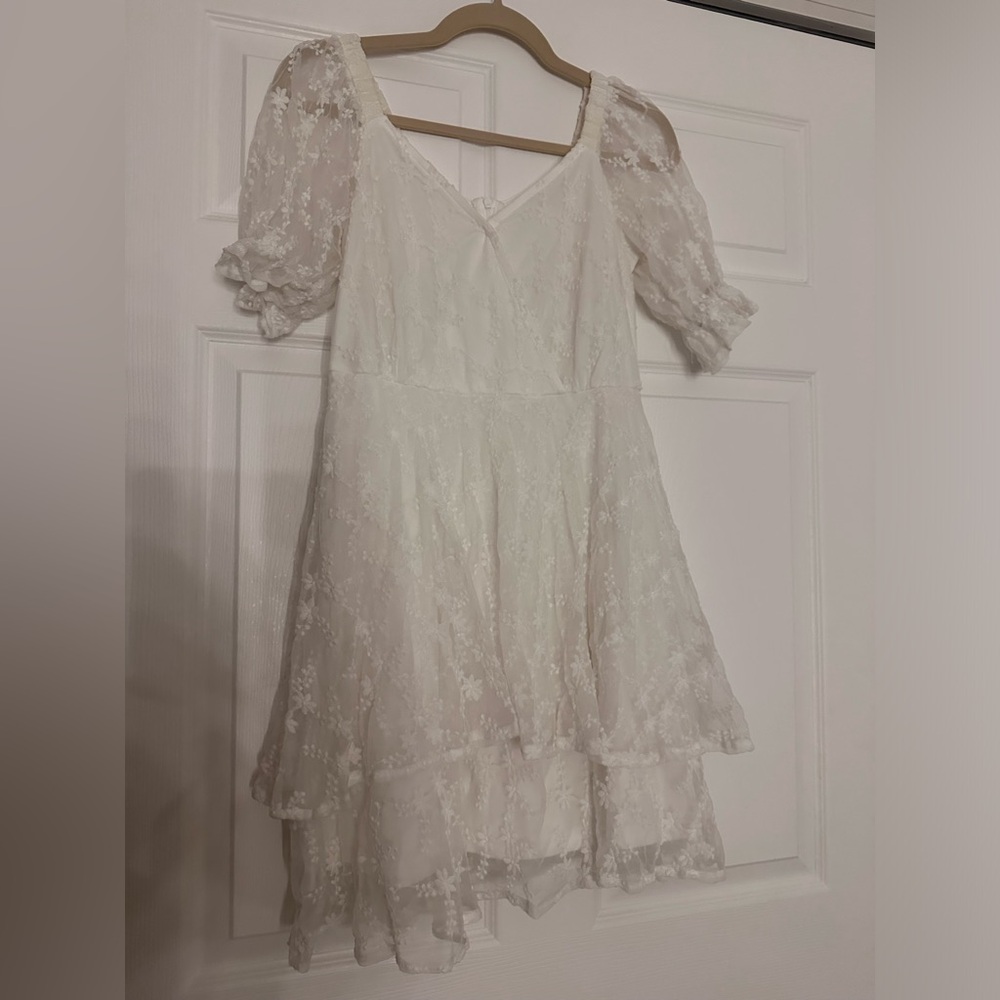 White dress with floral lace details